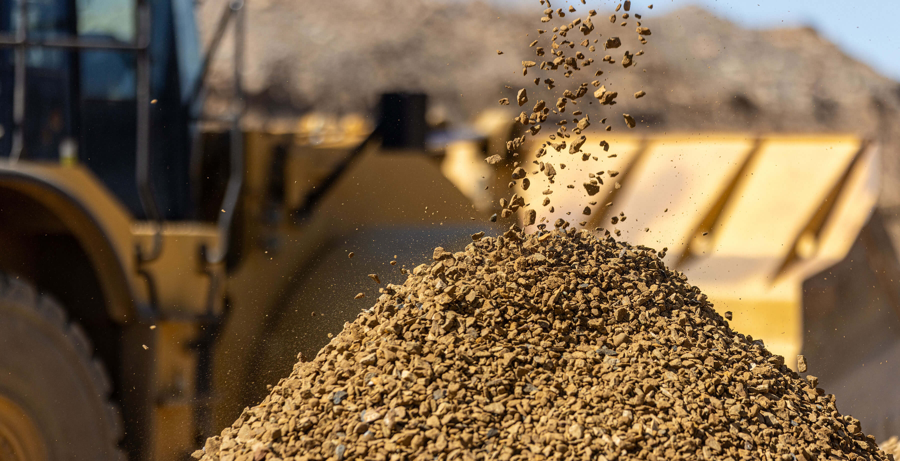 Loader pouring fresh gravel at the Magnolia Sand & Gravel yard